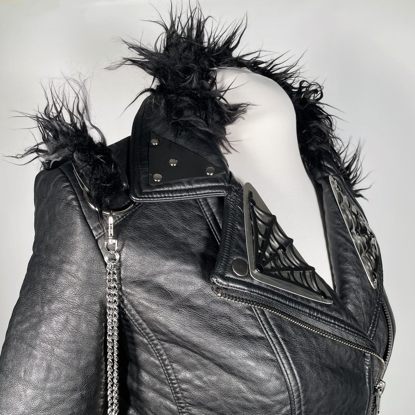 Black Pleather Moto with Metal Plating, PVC Spiderwebs, Faux Fur Trim and Chains