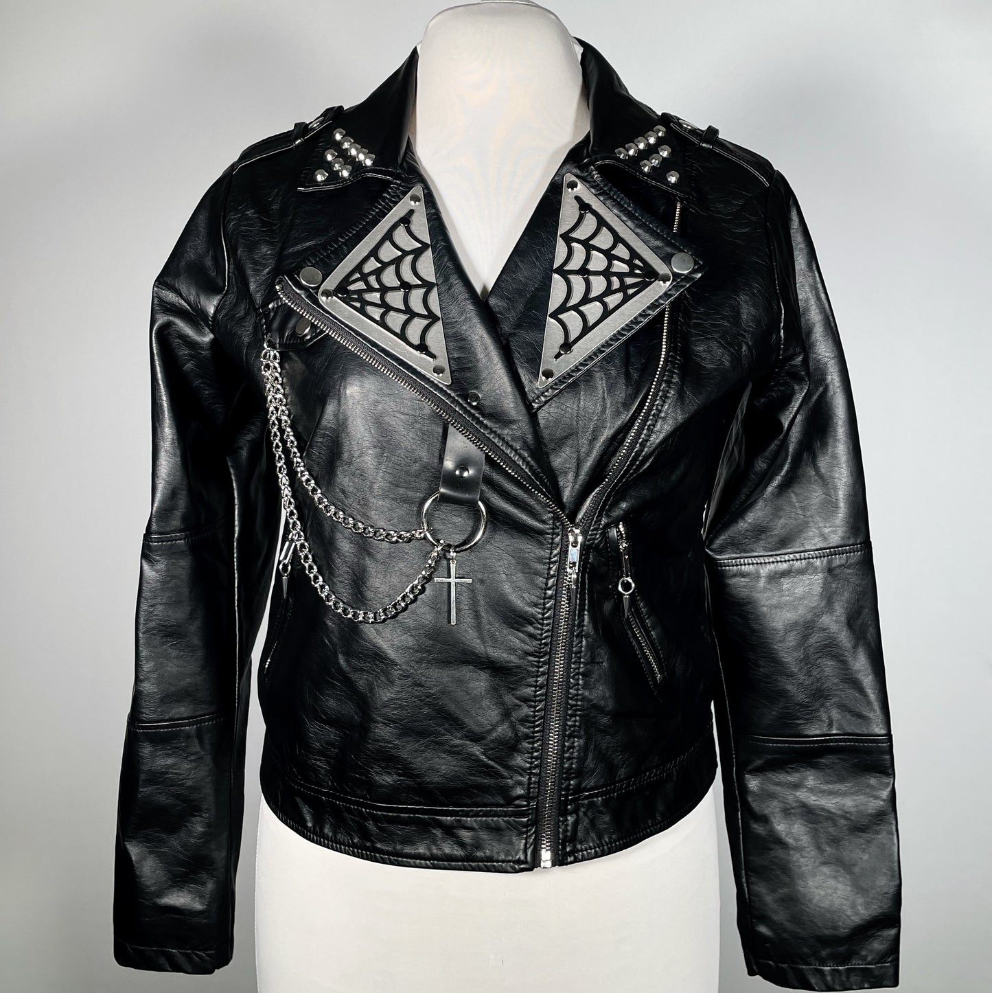 Black Pleather Moto with Metal Plating, PVC Spiderwebs, Studded Lapel and Chains with Cross